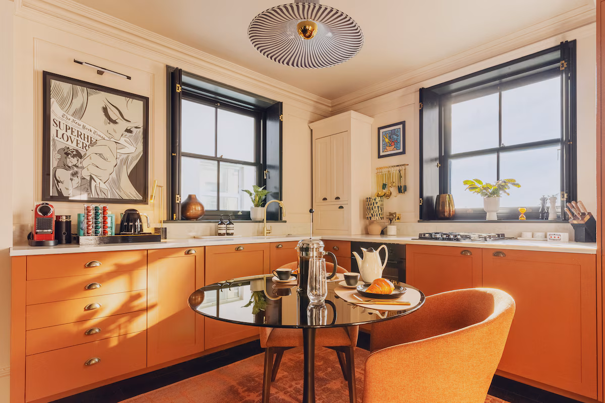 Warm, welcoming kitchen and dining nook — the after of a MacProperties Optics edit.